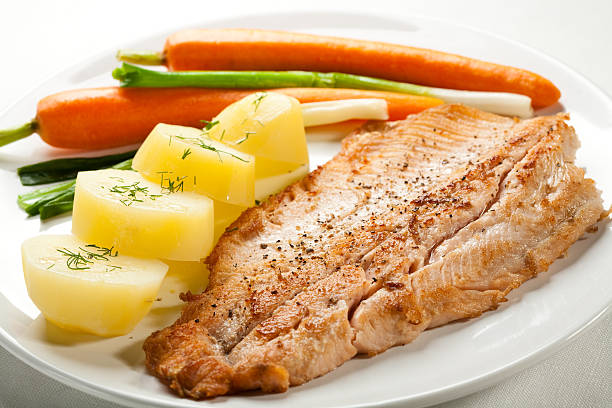 Breakfast: Dried Fish (Te Karau) with Boiled Breadfruit/Taro (Pronounced: /draɪd fɪʃ (teɪ kɑːˈraʊ) wɪð bɔɪld ˈbrɛdfruːt / ˈtɑːroʊ/) – Rehydrated Dried Fish Served with Boiled Root Vegetables