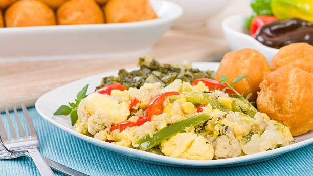 Breakfast: Saltfish and Bakes (Pronounced: /sɑːltfɪʃ ənd beɪks/) – Salted Codfish and Fried Dough